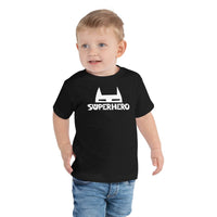 Custom printed superhero toddler tee featuring bold mask icon and playful typography, perfect for personalization.