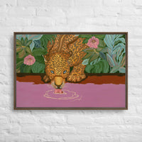 Custom framed canvas art of a leopard drinking from a purple river, featuring vibrant colors and lush greenery.